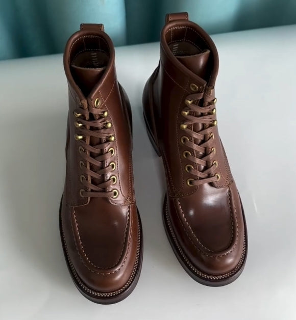 Brown hand-stitched high-top boots