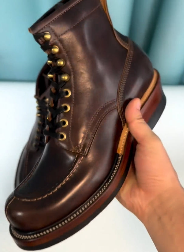 Brown hand-stitched high-top boots