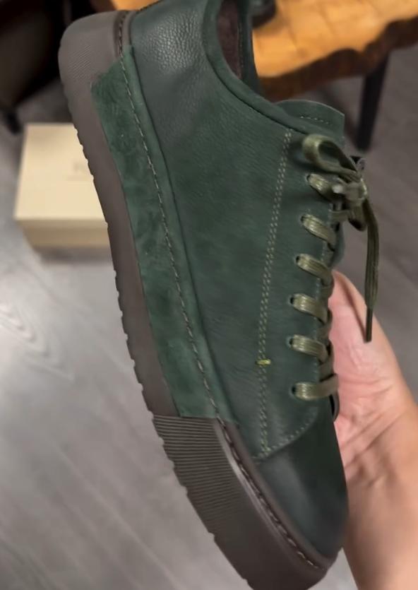 Green suede shoes with brown soles