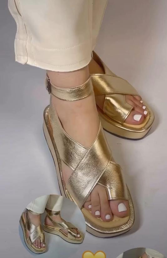 Golden buckle with heightening sandals