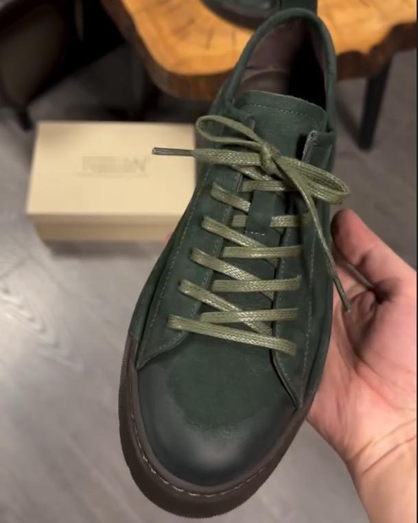 Green suede shoes with brown soles