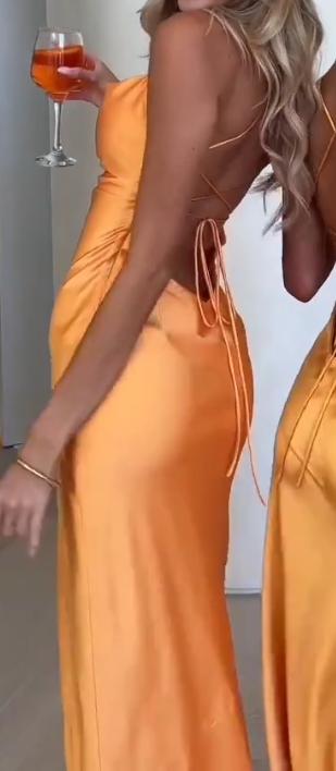 Stylish sexy orange skirt with suspenders
